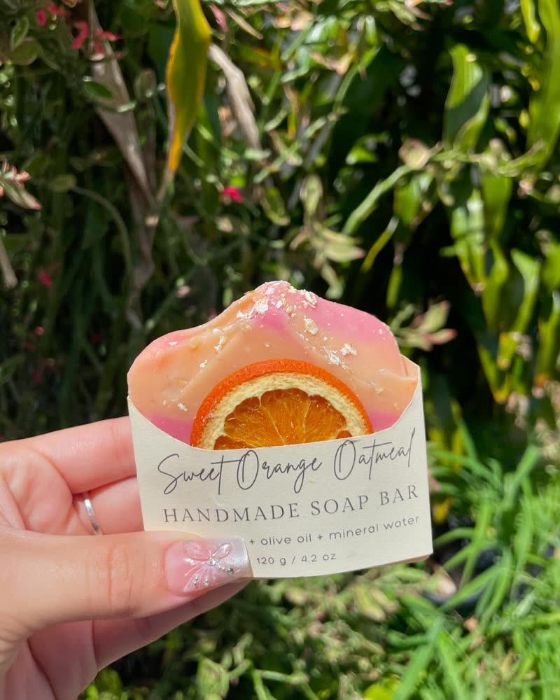 Sweet Orange Oatmeal handmade soap bar with a dried orange slice