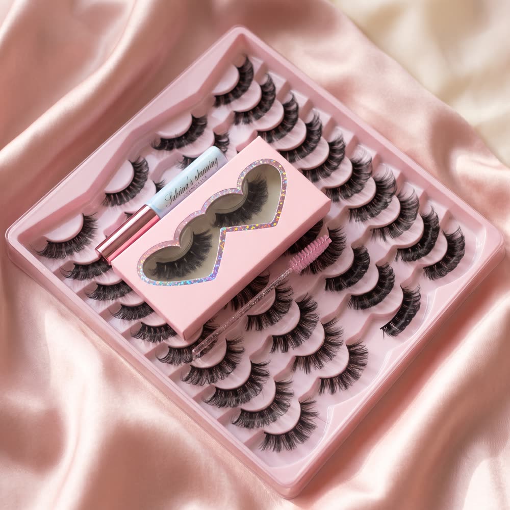 A tray of strip lashes with a pink heart lash case